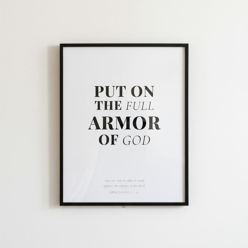 Ephesians 6 Wall Art Put on the Full Armor of God Scripture Print Christian Boys, in contemporary bold serif typography in black on clean white background, styled on a wooden floating shelf next to a ceramic vase with dried eucalyptus, creating a warm and inviting Christian home decor vignette