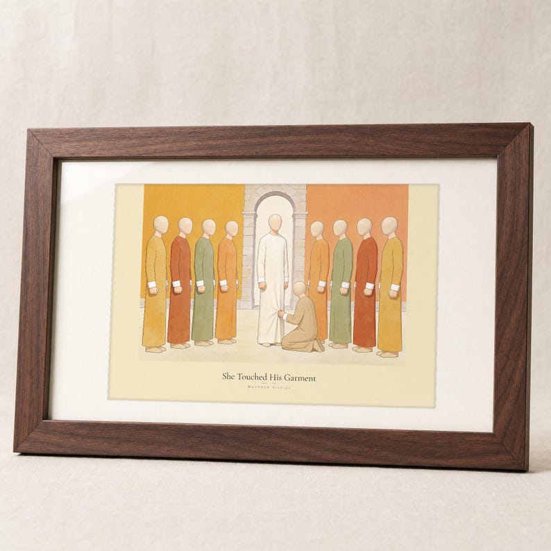 She Touched His Garment Matthew 9:20-22 print in a solid walnut frame with a cream mat, frontal studio shot on a soft linen backdrop, gentle diagonal window light crossing the glass, e-commerce hero photograph of biblical wall art, modern scripture illustration, Christian digital download by TheFramedVerse on Etsy