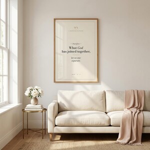 Mark 10:9 'What God Has Joined Together, Let No One Separate' modern Christian wedding wall art print framed in light oak above a cream linen sofa, terracotta vase with dried pampas grass on console, soft natural daylight, minimalist farmhouse Christian newlywed home decor, instant digital download from TheFramedVerse on Etsy