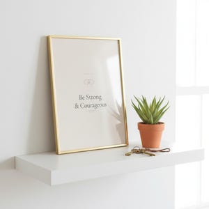 Be Strong and Courageous Joshua 1:9 sage coquette scripture wall art print lifestyle scene in bright modern bedroom, coquette room decor aesthetic christian, bible verse artful sage green print, godly wall art trendy christian art digital download from TheFramedVerse for dorm room decor