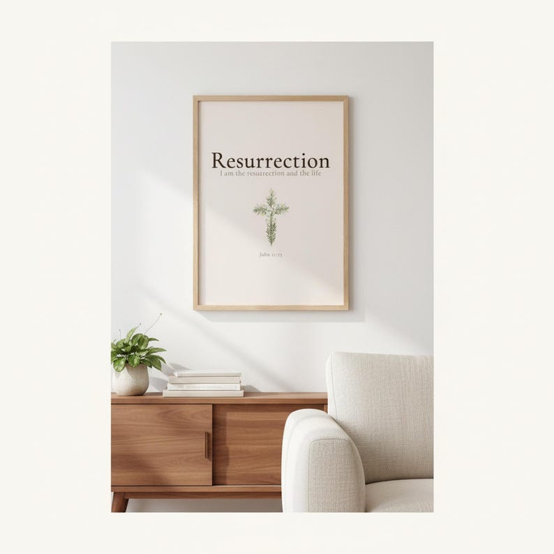 He is Risen Easter Wall Art, Floral Cross Scripture Print, — "He is not here; He has risen, just as He said", in beautiful floral cross composed of spring roses, greenery and wildflowers, displayed in a beautifully styled modern living room above a warm wooden sideboard with soft natural light creating gentle shadows on the frame, — a meaningful easter gift and beautiful Christian home decor