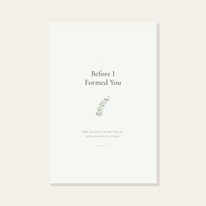 Jeremiah 1 5 Before I Formed You Nursery Bible Verse Print Christian Wall Art, in gentle sage green nursery design with soft botanical watercolor illustration, calming earth tones and tender serif typography, displayed above a wooden changing table in a warm nursery with stuffed animals and soft blankets, creating a loving Christian atmosphere for daily routines with baby