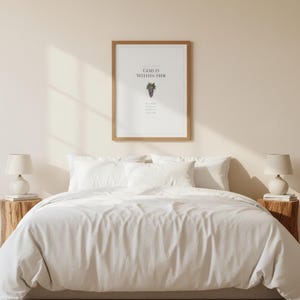 Mothers Day Scripture Wall Art Set of 3 Proverbs 31 25 Christian Mom Gift Bible, in elegant Mother's Day design with soft pink watercolor botanical flowers and graceful serif typography, hanging above a cozy bed in a peaceful bedroom setting, creating an inspiring and calming atmosphere for morning devotions and evening prayer
