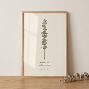 1 Chronicles 16:11 seek the Lord and his strength bible verse wall art in floating glass frame with natural light reflection. Vintage eucalyptus botanical illustration with modern christian scripture typography on archival cream paper. Part of wildfl