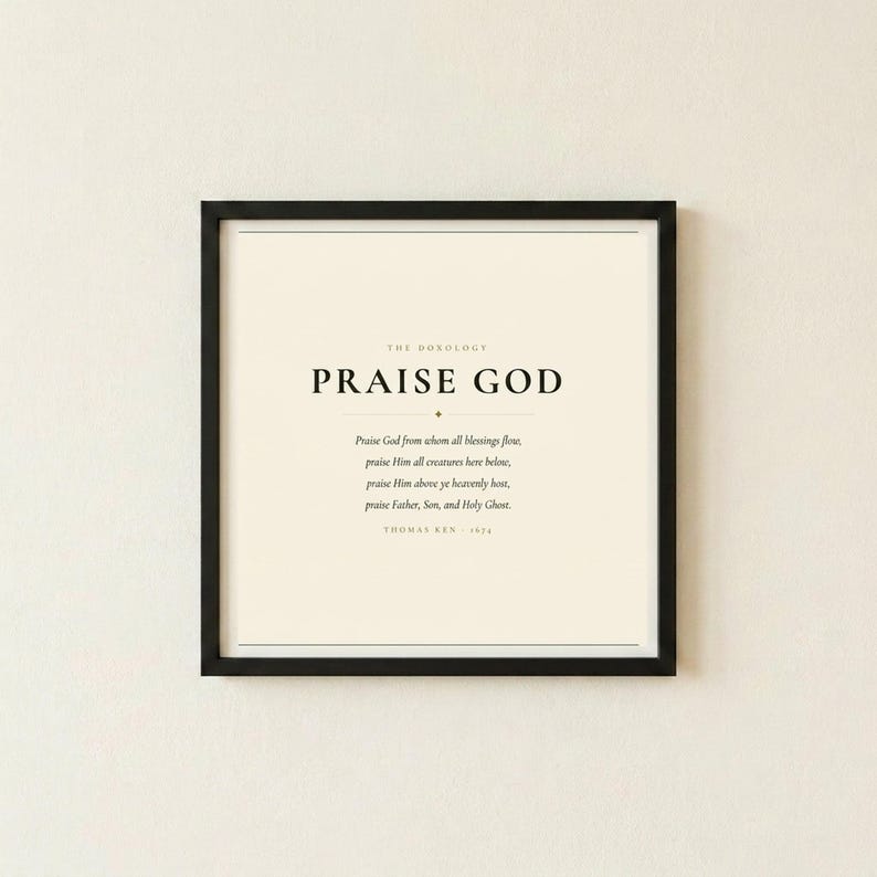 Doxology Praise God From Whom All Blessings Flow hymn lyric art print in thin black frame on warm cream textured wall, front-facing clean product photo, dark forest green minimalist typography on cream background, christian doxology wall art hymn song lyric print baptism gift confirmation gift wedding
