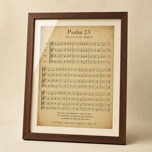 Psalm 23 psalm 23 print in solid walnut wood frame, frontal slightly tilted on neutral cream studio backdrop, top-left key light with subtle glass reflection, e-commerce hero product photograph, psalms 23 digital download, Psalm 23 scripture, TheFramedVerse lord is my shepard Digital download from TheFramedVerse on Etsy, instant scripture art.