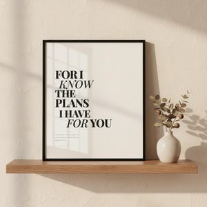 Jeremiah 29:11 Wall Art For I Know the Plans I Have for You Modern Christian, — "For I know the plans I have for you, declares the Lord, plans to prosper you", in contemporary bold serif typography in black on clean white background, showcased in an elegant contemporary home interior with curated decor elements, demonstrating how this Christian art piece elevates any living space