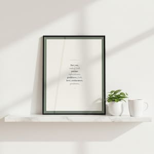 1 Timothy 6:11 Man of God scripture wall art print in black glass frame on white marble shelf with green potted plant and white coffee mug. Window light creating diagonal shadow. But you man of God pursue righteousness godliness faith love endurance gentleness ESV. Sage green Christian Father Day gift for dad husband pastor digital download printable wall art for home office bedroom living room