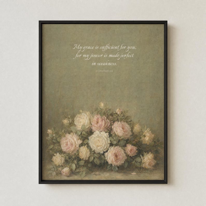 My Grace Is Sufficient 2 Corinthians 12:9 vintage oil painting print in thin black metal frame, shown frontal on off-white textured plaster wall, modern minimalist hanging style, soft single top light source creating gentle shadow below frame, antique floral Christian wall art instant digital download from TheFramedVerse