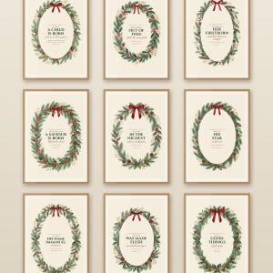 Nativity Christmas Story Scripture gallery wall set of nine watercolor Bible verse prints in slim oak frames on a warm cream wall — Isaiah 9:6, Micah 5:2, Luke 2, Matthew 2:2, Matthew 1:23 and John 1:14 — each verse framed in a festive evergreen wreath with holly, red berries and gold. Printable Christian Christmas wall art digital download from TheFramedVerse on Etsy.