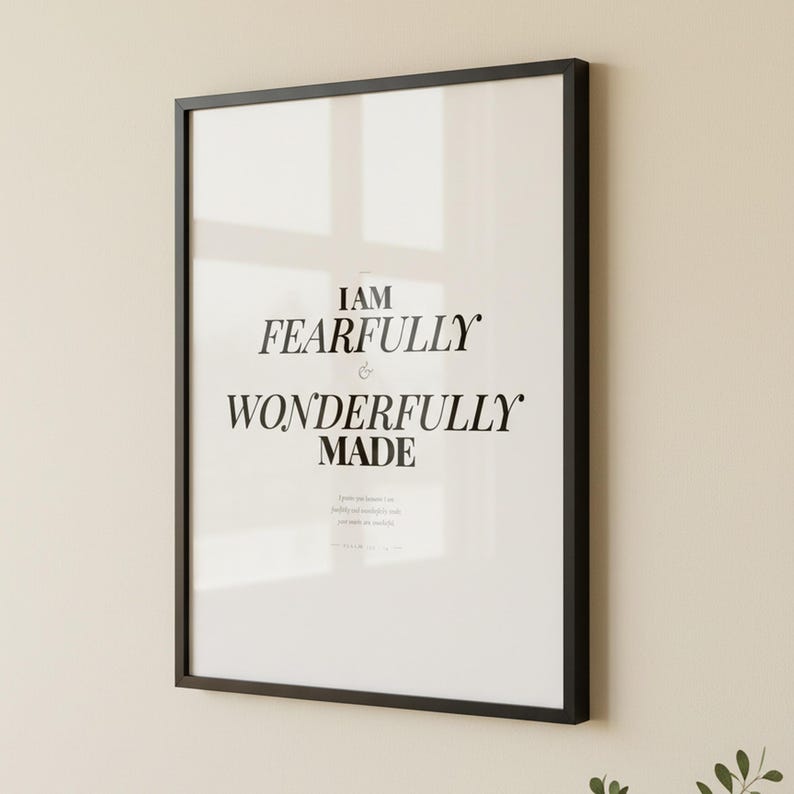 Psalm 139 14 Wall Art Fearfully and Wonderfully Made Scripture Print Nursery, — "I praise you because I am fearfully and wonderfully made; your works are wonderful", in gentle sage green nursery design with soft botanical watercolor illustration and calming earth tones, photographed in beautiful close-up detail showing the premium glass frame reflection