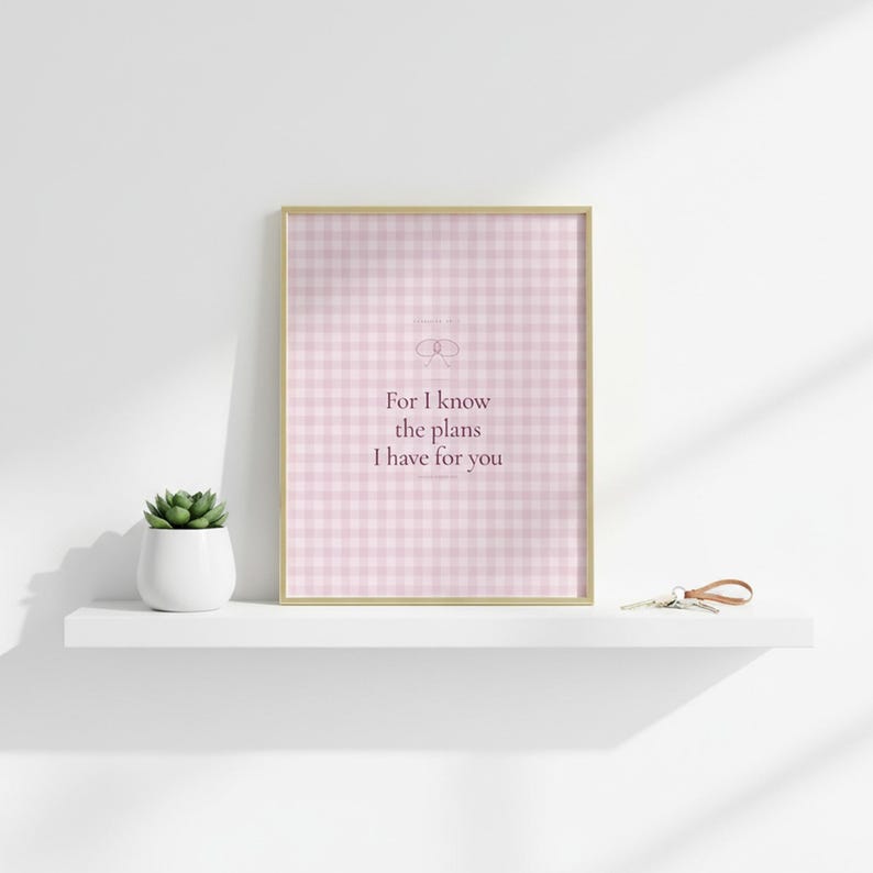 For I Know the Plans I Have for You Jeremiah 29:11 Wall Art Pink Blush Coquette  — botanical glass frame mockup with natural light and greenery. This coquette bow, pink blush christian scripture wall art print features beautiful serif typography on warm cream background. Jeremiah 29:11 bible verse digital download printable for home office bedroom living room gallery wall decor. Perfect christi...