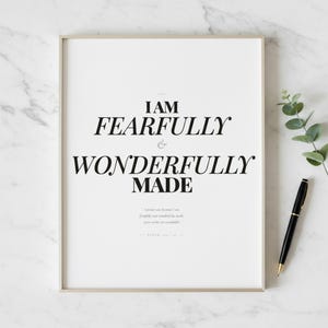 Psalm 139 14 Wall Art Fearfully and Wonderfully Made Scripture Print Nursery, — "I praise you because I am fearfully and wonderfully made; your works are wonderful", in gentle sage green nursery design with soft botanical watercolor illustration and calming earth tones, showcased in an elegant contemporary home interior with curated decor elements, demonstrating how this Christian art piece