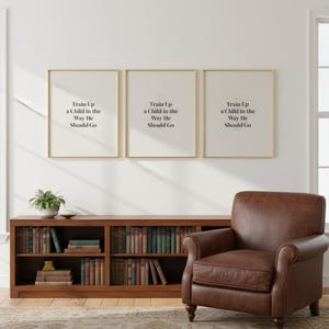 As For Me and My House We Will Serve the Lord Joshua 24:15 Wall Art Christian Fa — room setting mockup in cozy living space with complementary decor. This Fathers Day christian scripture wall art print features beautiful serif typography on warm cream background. Joshua 24:15 bible verse digital download printable for home office bedroom living room gallery wall decor. Perfect christian gift id...