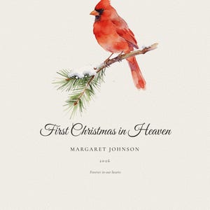 Second personalization variant showing a longer loved one's name within the First Christmas in Heaven cardinal print. Alexandra Catherine Montgomery and 2026 appear beneath snowy pine branches and a red cardinal. The balanced layout demonstrates how extended names are centered clearly while preserving the peaceful spacing and refined seasonal character of the memorial artwork.