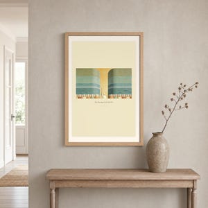 Room mockup of The Parting of the Red Sea displayed in a light oak frame on a warm neutral wall. The landscape artwork shows Moses on the centre axis between two towering walls of water while the people cross the dry seabed. A wide cream mat and restrained fresco palette suit a calm living room, prayer space, or Christian home. The printed title and Exodus 14:21 remain visible beneath the image.