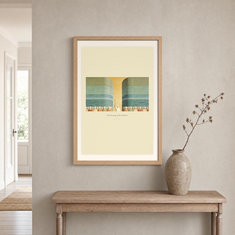 Room mockup of The Parting of the Red Sea displayed in a light oak frame on a warm neutral wall. The landscape artwork shows Moses on the centre axis between two towering walls of water while the people cross the dry seabed. A wide cream mat and restrained fresco palette suit a calm living room, prayer space, or Christian home. The printed title and Exodus 14:21 remain visible beneath the image.