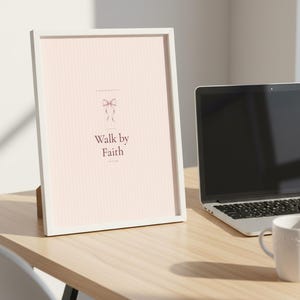 Walk by Faith Not by Sight 2 Corinthians 5:7 Wall Art Pink Blush Coquette Christ — room setting mockup in cozy living space with complementary decor. This coquette bow, pink blush christian scripture wall art print features beautiful serif typography on warm cream background. Sight 2 bible verse digital download printable for home office bedroom living room gallery wall decor. Perfect christian...