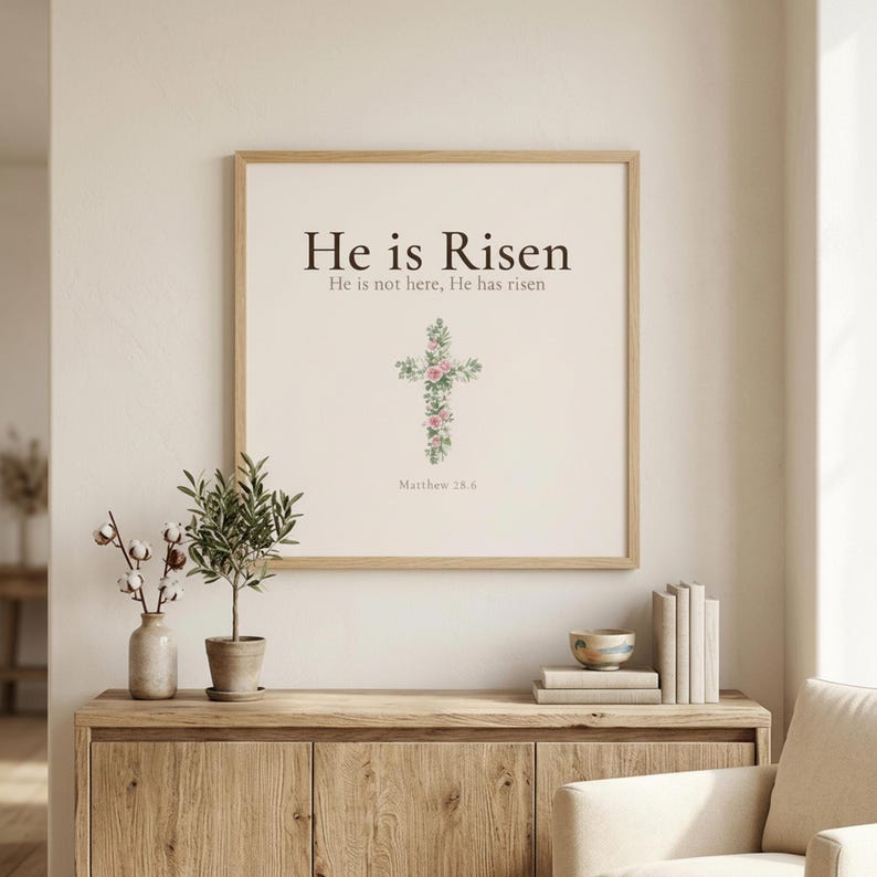 Easter He is Risen Scripture Art Set, Floral Cross Bible Verse Prints, — "He is not here; He has risen, just as He said", in beautiful floral cross composed of spring roses, greenery and wildflowers, showcased in an elegant contemporary home interior with curated decor elements, demonstrating how this Christian art piece elevates any living space