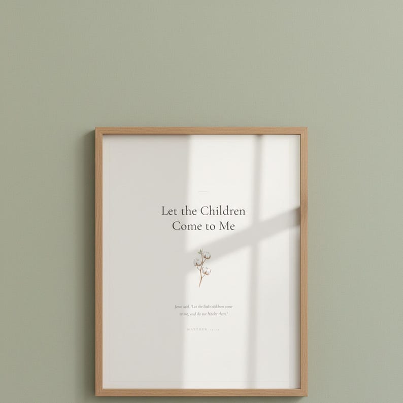 Matthew 19 14 Let the Children Come to Me framed scripture print in oak frame with glass reflection hung on sage green wall. Close-up hero product shot showing watercolor cotton flower illustration and Bible verse. Christian nursery printable digital download for baptism gift.