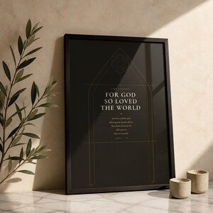 Dark Academia John 3:16 print in glass frame with dark botanical greenery styling. For God So Loved the World scripture art with gothic arch window motif on deep charcoal background. Moody Christian wall art digital download perfect as a housewarming or confirmation gift.