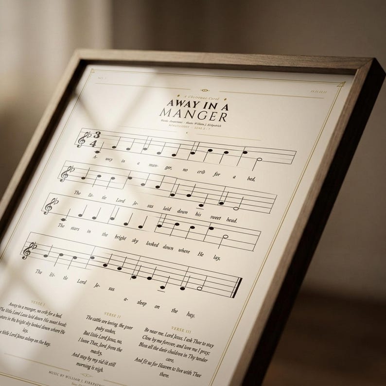 Extreme close-up macro of Away in a Manger vintage hymnal print on premium archival matte paper — showing aged sepia paper texture, 1900s-era sheet music typography, ink saturation and crisp letterpress detail, no props, editorial product shot, Christmas carol wall art digital download by TheFramedVerse on Etsy