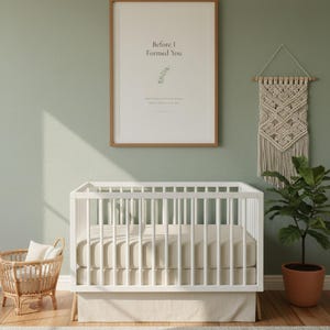 Jeremiah 1 5 Before I Formed You nursery wall art in oak frame on sage green wall above white crib with macrame and rattan decor. Watercolor eucalyptus branch botanical illustration. Gender neutral Christian nursery printable digital download for baptism baby shower christening gift.