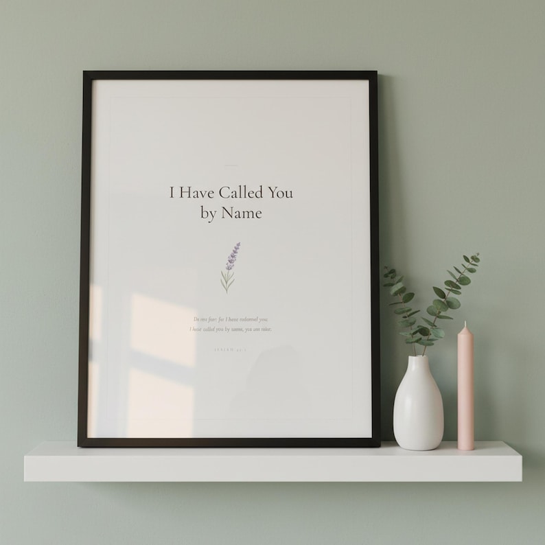 Isaiah 43 1 I Have Called You by Name scripture print in black frame with glass on white shelf against sage green wall. Eucalyptus vase and pink candle. Watercolor lavender sprig illustration. Christian nursery Bible verse printable digital download.