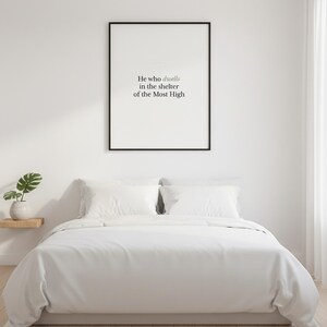 Psalm 91:1 Wall Art He Who Dwells in the Shelter of the Most High Minimalist Scr — front facing framed mockup on clean white wall with shadow. This modern minimalist christian scripture wall art print features beautiful serif typography on warm cream background. Psalm 91:1 bible verse digital download printable for home office bedroom living room gallery wall decor. Perfect christian gift idea ...
