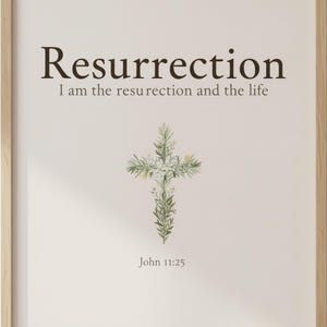 He is Risen Easter Wall Art, Floral Cross Scripture Print, in beautiful floral cross composed of spring roses, greenery and wildflowers, styled on a wooden floating shelf next to a ceramic vase with dried eucalyptus, creating a warm and inviting Christian home decor vignette. Instant digital download printable wall art in multiple sizes for easy home printing