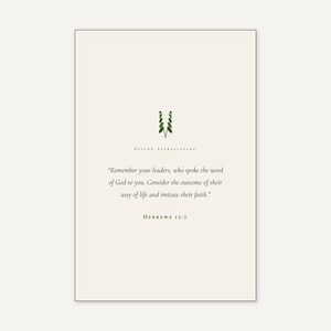 Hebrews 13:7 Remember Your Leaders scripture print in thin black frame on white marble, single olive branch and two unlit votive candles, warm beige textured backdrop, bright morning light with clean glass reflection, still life editorial pastor appreciation christian print digital download by TheFramedVerse