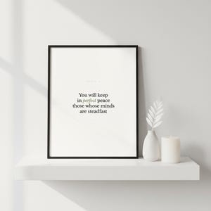 Scripture Wall Art Set of 6 Minimalist Bible Verse Prints Modern Christian Home  — botanical glass frame mockup with natural light and greenery. This modern minimalist christian scripture wall art print features beautiful serif typography on warm cream background. digital download printable for home office bedroom living room gallery wall decor. Perfect christian gift idea from TheFramedVerse o...