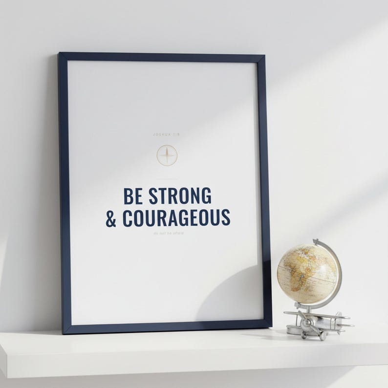 Be Strong and Courageous Joshua 1:9 Wall Art Christian Boys Room Print Scripture — lifestyle mockup in modern room setting with elegant framed print on wall. This elegant christian scripture wall art print features beautiful serif typography on warm cream background. Joshua 1:9 bible verse digital download printable for home office bedroom living room gallery wall decor. Perfect christian gift ...