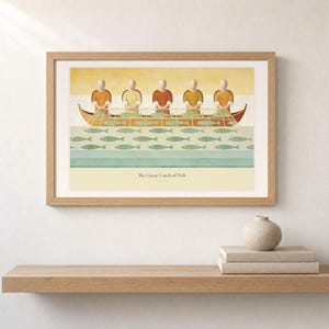 Shelf mockup of The Great Catch of Fish in a light oak frame resting on a pale wood surface beside stacked neutral books and a rounded ceramic vase. The framed print shows faceless fishers lifting a broad net filled with sage fish beside a wooden boat. Cream matting, soft wall texture, and natural light present the horizontal Bible artwork at an easy domestic scale.