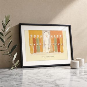 She Touched His Garment Matthew 9:20-22 print in a black wood frame on white marble, a single olive branch beside it and two lit stone candles, warm beige textured wall, bright natural morning light with a soft glass reflection, editorial still life Christian wall art digital download by TheFramedVerse