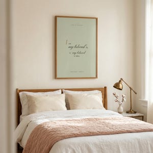 Song of Solomon 6:3 coquette sage Christian wedding wall art print framed in oak above a velvet blush sofa with cream knit throw and ivory pillows, gold side table with ceramic mug, romantic farmhouse Christian newlywed living room, soft afternoon light, digital download from TheFramedVerse Etsy
