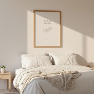 The Lord Bless You Numbers 6 24 26 Nursery Bible Verse Print Christian Wall Art, in gentle sage green nursery design with soft botanical watercolor illustration and calming earth tones, styled on a wooden floating shelf next to a ceramic vase with dried eucalyptus, creating a warm and inviting Christian home decor vignette