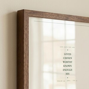 Straight front view of the complete artwork in a clean frame, making the typography and full composition easy to see. The God Says You Are Loved Chosen Worthy Known Enough His artwork uses minimalist forest green typography on warm beige. This Christian affirmation print suits a nursery, baptism gift, baby dedication, bedroom, or encouraging faith centered space as digital wall art.