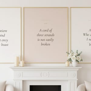 Christian Wedding Wall Art Set of 3 Bible Verse Prints Love Is Patient, — "Love is patient, love is kind. It does not envy, it does not boast", in romantic wedding typography with elegant calligraphy, delicate gold ornamental accents on warm blush background, showcased in an elegant contemporary home interior with carefully curated decor, demonstrating how this faith-inspired art piece
