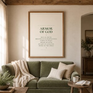 Armor of God Ephesians 6 scripture print bold minimalist christian wall art boys room confirmation baptism gift dark forest green typography on warm cream background, above sage grey linen sofa bright airy living room natural window light room lifestyle scene, digital download printable wall art instant download