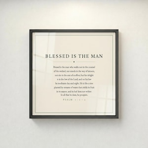 Psalm 1 Blessed Is The Man wall art displayed straight-on in a thin black gallery frame against a light grey wall. Full Psalm 1:1-3 verse in clean minimalist typography. Forest green on cream, bold, intentional, and timeless. Printable christian scripture art for men, ideal Father's Day bible verse gift. TheFramedVerse digital download.