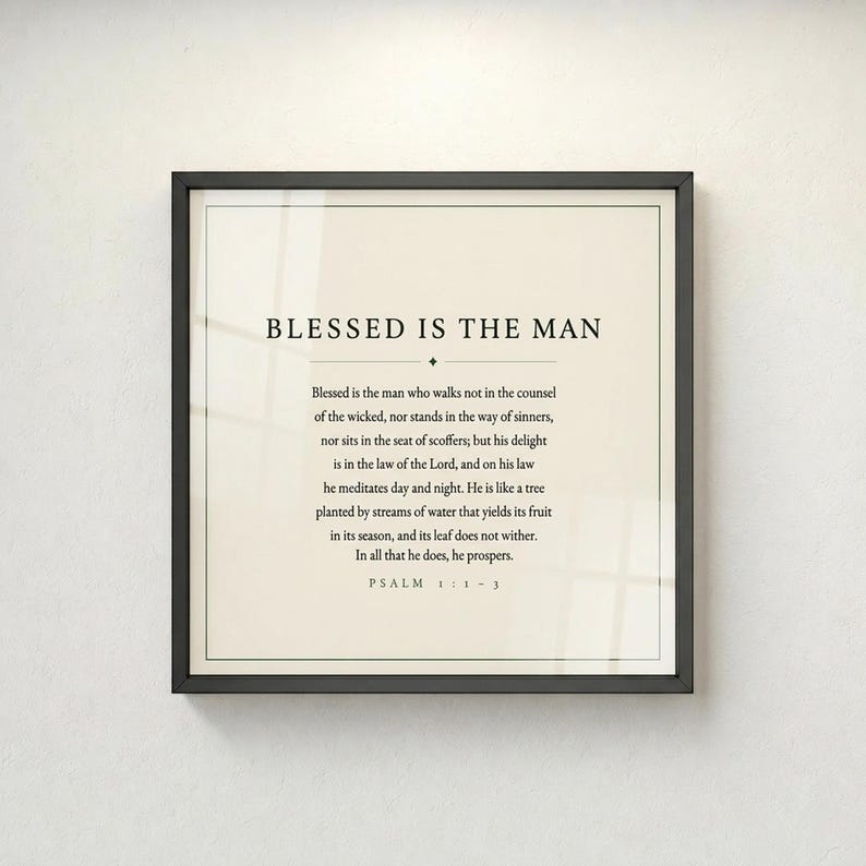 Psalm 1 Blessed Is The Man wall art displayed straight-on in a thin black gallery frame against a light grey wall. Full Psalm 1:1-3 verse in clean minimalist typography. Forest green on cream, bold, intentional, and timeless. Printable christian scripture art for men, ideal Father's Day bible verse gift. TheFramedVerse digital download.