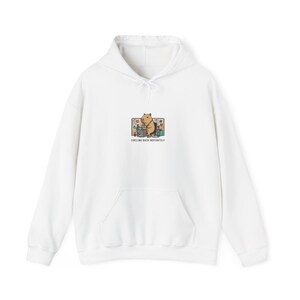 May include: White hoodie with a kangaroo pocket and drawstring hood. The front features a small graphic of a capybara at a desk with the text "CIRCLING BACK INDEFINITELY" below the graphic. The hoodie is made of a soft, comfortable material.