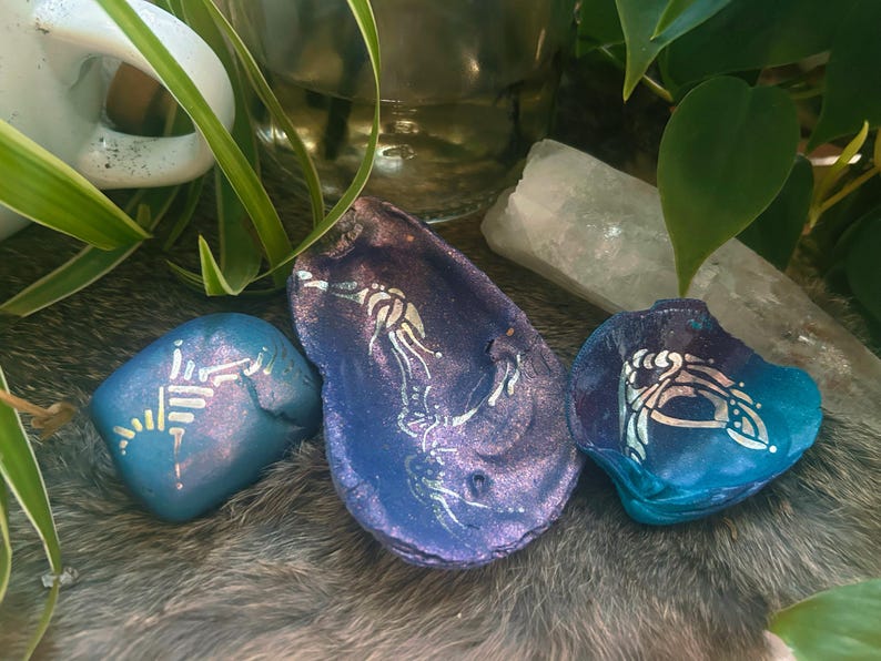 Custom channeled relic set — hand-painted stones and shells with channeled symbols
