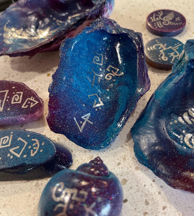 Hand-painted channeled symbol sets on stone and shell