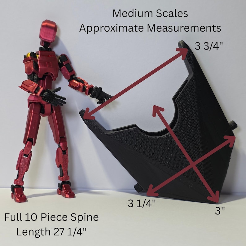 May include: A metallic red articulated action figure standing next to a black, triangular-shaped component with textured surfaces. The component features dimensions of 3 3/4 inches, 3 1/4 inches, and 3 inches. Text reads Medium Scales Approximate Measurements.