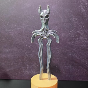 May include: A set of three ceramic canisters with lids. The canisters are white with a blue floral pattern. The largest canister is 8 inches tall, the medium is 6 inches, and the smallest is 4 inches.