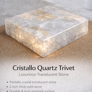 May include: A square Cristallo Quartz trivet, 2 inches thick, with a translucent, crystalline pattern. The trivet is made of durable, heat-resistant stone, designed to protect countertops from hot items.