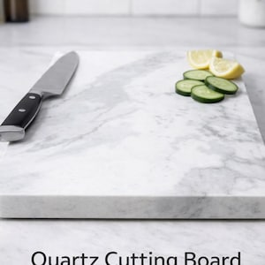 May include: A white ceramic mug with a black handle and the text "But First, Coffee" in a handwritten style. The mug is on a white surface. The mug is approximately 4 inches tall.