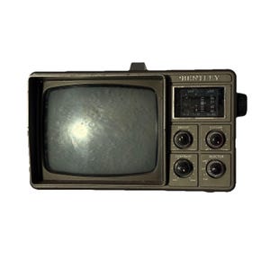 May include: A vintage Bentley portable television with a dark grey plastic casing. The front features a screen, a channel tuning display, and four circular knobs labelled Bright, Volume, Contrast, and Selector for adjusting settings.